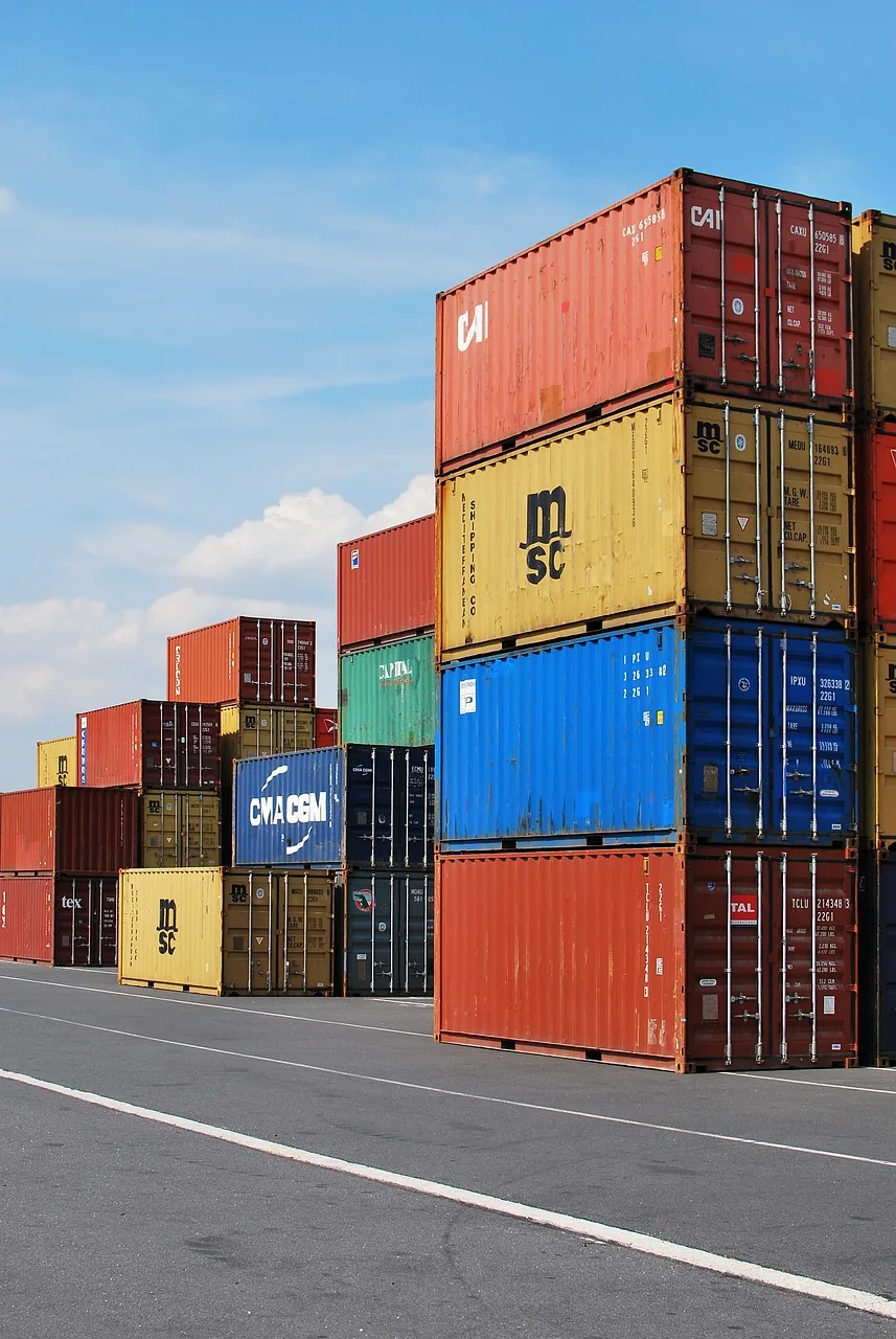 Stacked shipping containers in an open container yard
